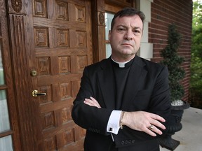 Father Robert Couture is seen outside St. Anne's Church in this file photo. (Dan Janisse/The Windsor Star)