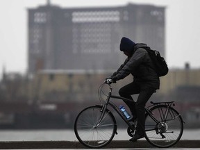 File photo of a bicyclist makes his way west along Riverside Drive West. (Windsor Star files)