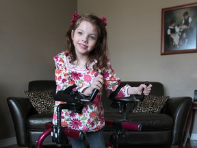 Hallie Ganderton, 7, is shown at her Cottam, Ont. home, Monday, April 1, 2013. The youngster's family is hoping that their daughter who has cerebral palsy can win a handicap accessible van that is available through on online voting contest. (DAN JANISSE/The Windsor Star)