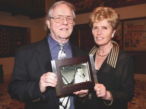 Clayton Moore, left, and Catherine O'Brien hold a photo of George Z. Hart during a memorial event held in honour of Hart at Fogular Furlan in Windsor on Sunday, April 28, 2013. Hart, who is O'Brien's late husband, was an American politician and was known as "the singing senator" and was well-known for often singing at local Legions. Hart died on Jan. 31 at age 88. (REBECCA WRIGHT/ The Windsor Star)