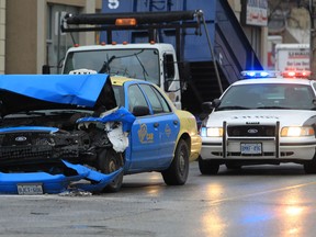 The remains of a Veteran Taxi is seen at the corner of Wyandotte Street east at Louis Avenue in Windsor, Ontario following an accident with a pickup truck on Friday April 19, 2013 in Windsor, Ontario. The morning accident tied up traffic for under an hour. (Jason Kryk/The Windsor Star)