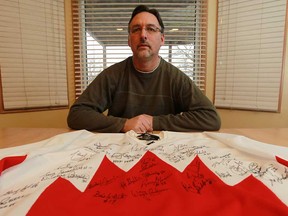 Bill Dubs is photographed with his team Canada jersey at his home in Belle River on Thursday, April 11, 2013. Dubs is upset that hockey legend Ken Dryden refused to sign it. Dryden is the only living player that played on the 1972 team who hasn't signed the jersey.                             (TYLER BROWNBRIDGE/The Windsor Star)