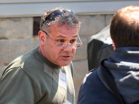 Philip Laforet tries to explain criminal charges against him to Windsor Star reporter Trevor Wilhelm, from the backyard of his Tecumseh residence, Wednesday April 17, 2013. Laforet has been charged with criminal harassment and intimidation as a justice system participant. (NICK BRANCACCIO/The Windsor Star)