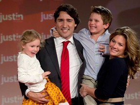 Justin Trudeau, his wife Sophie Gregoire and their children Xavier and Ella-Grace celebrate after he won the Federal Liberal leadership Sunday April 14, 2013 in Ottawa. (THE CANADIAN PRESS/Adrian Wyld)