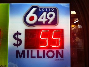 A Lotto 6/49 sign is shown at the Downtown Cigar Shop on Ouellette Avenue in Windsor, Ont. on Apr. 11, 2013. The Apr. 13 draw is for the biggest jackpot in Canadian lottery history - $55 million! (Jason Kryk / The Windsor Star)