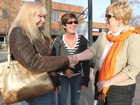 NDP nomination candidate Laurie Komon, right, shakes hands with Ruth Charles, left, during an outdoor meet and greet event Komon hosted at Whelpton Park on Drouillard Road Saturday, April 27, 2013. Komon is up against Percy Hatfield for the NDP nomination for Windsor-Tecumseh provincial seat. (REBECCA WRIGHT/ The Windsor Star)