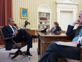 In this handout provided by the White House, U.S. President Barack Obama (L) talks on the phone with FBI Director Robert Mueller to receive an update on the explosions that occurred in Boston, in the Oval Office of the White House, April 15, 2013 in Washinton, DC. Seated with the President are Lisa Monaco, Assistant to the President for Homeland Security and Counterterrorism, and Chief of Staff Denis McDonough. Two people are confirmed dead and at least 23 injured after two explosions went off near the finish line to the marathon. (Photo by Pete Souza/The White House via Getty Images)