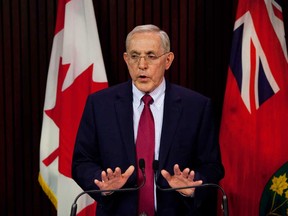 Liberal Energy Minister Bob Chiarelli takes questions from the media following Ontario auditor general Jim McCarter's press conference at Queen's Park in Toronto about the cancellation of the Mississauga power plant, on Monday, April 15, 2013.  (THE CANADIAN PRESS/Matthew Sherwood)