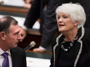Education Minister Liz Sandals, right, chats to Ontario Secondary School Teachers Federation President Ken Coran before Lieutenant Governor David Onley delivers the throne speech at the Ontario Legislature in Toronto on Tuesday February 19, 2013. (THE CANADIAN PRESS/Chris Young)
