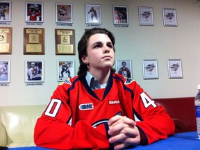 Ryan Moore of Detroit Belle Tire Minor Midgets signs with Windsor Spitfires on April 16, 2013. (Nick Brancaccio/The Windsor Star)