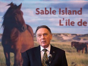 Environment Minister Peter Kent announces measures to protect Sable Island at a news conference in Halifax on Tuesday, Feb. 12, 2013. Wind power project on Sable Island off Nova Scotia is over budget and remains at a standstill more than a decade after the federal government launched the initiative.(THE CANADIAN PRESS/Andrew Vaughan)