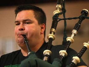 Members of the Scottish Society of Windsor Pipe Band practise Thursday, April 11, 2013, at the Scottish Club in Windsor, Ont. Piper Dan MacKinnon is shown during the practice. (DAN JANISSE/The Windsor Star)