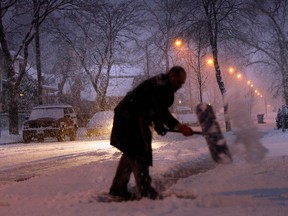 A man shovels snow in this file photo. (Jason Kryk/The Windsor Star)