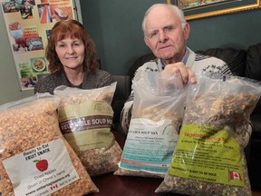 Tina Quiring, left, and Vern Toews of the Southwestern Ontario Gleaners display samples of dehydrated food mixes on Tuesday, April 9, 2013. The packages were made from unmarketable or surplus produce and will be given to the poor. (DAN JANISSE/The Windsor Star)