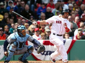 Shane Victorino of the Boston Red Sox fouls a ball off in the bottom of the ninth inning against the Tampa Bay Rays at Fenway Park on April 15, 2013 in Boston, Massachusetts. All uniformed team members are wearing jersey number 42 in honor of Jackie Robinson Day. (Photo by Alex Trautwig/Getty Images)