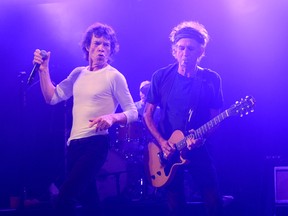 Musicians Mick Jagger (L) and Keith Richards of The Rolling Stones perform at Echoplex on April 27, 2013 in Los Angeles, California. The Rolling Stones played a surprise club gig tonight in Los Angeles at the Echoplex - leading up to the launch of their "50 & Counting" tour on May 3, 2013 at the STAPLES Center in Los Angeles. (Photo by Kevin Mazur/Getty Images)