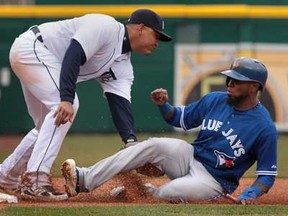 Detroit Tigers third baseman Miguel Cabrera, left, tags out Toronto's Jose Reyes, Thursday, April 11, 2013, at Comerica Park in Detroit. (DAN JANISSE/The Windsor Star)