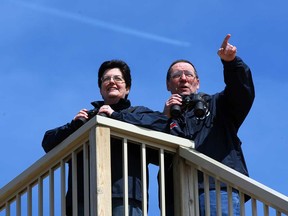 Gwen and Dennis Patrick have built a hawk tower to assist with Gwen's rehabilitation from a brain injury.  In photo, Gwen and Dennis take to their favourite pastime, watching birds of prey Thursday April 4, 2013. (NICK BRANCACCIO/The Windsor Star)