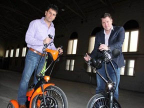 Arlindo Rocha, left, and Patrick Voortman of Urban Flexibility NA Inc. with their urban transporter Qugo, Wednesday April 3, 2013. (NICK BRANCACCIO/The Windsor Star)