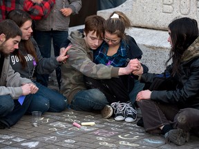 Several hundred people attend a community vigil to remember Rehtaeh Parsons at Victoria Park in Halifax on Thursday, April 11, 2013. The girl’s family says she ended her own life last week following months of bullying after she was allegedly sexually assaulted by four boys and a photo of the incident was distributed. THE CANADIAN PRESS/Andrew Vaughan