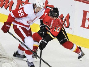 Detroit Red Wings Danny DeKeyser battles with Mike Cammalleri during the first period of the game Flames Red Wings game at the Scotiabank Saddledome on Wednesday March 17, 2013.  (Gavin Young/Calgary Herald)