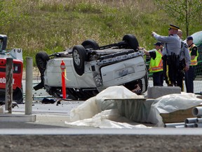 Police investigate the aftermath of a fatal car crash at the intersection of 176th Street and 32nd Avenue in Surrey, B.C. on Sunday, April 28, 2013. RCMP in British Columbia say five people are dead after a serious crash near the U.S border.THE CANADIAN PRESS/Eric Dreger