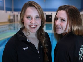 Jaina Gaudette, right, and Emma Gaudette, pose for a photo at the St. Clair College swimming pool. (DAX MELMER/The Windsor Star)