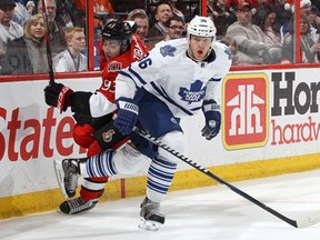 Toronto's Carl Gunnarsson, right, is checked by Ottawa's Mika Zibanejad Saturday at Scotiabank Place in Ottawa. (Photo by Jana Chytilova/Freestyle Photography/Getty Images)