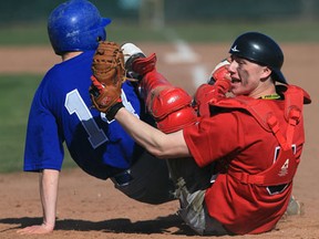 Essex catcher Mitch Hudvagner, right, attempts to tag Villanova's Adam Hyslop at home plate Monday during the WECSSAA boys baseball game at Villanova. Hyslop was safe at home.  Villanova defeated Essex 10-1. (JASON KRYK/The Windsor Star)