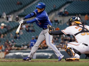 Baltimore catcher Matt Wieters looks on as Toronto's Munenori Kawasaki flies out for the third out of the third inning at Oriole Park at Camden Yards. (Photo by Rob Carr/Getty Images)