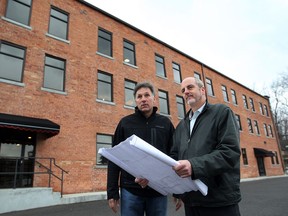 Developer Mike Brkovich , left, and Dave McCloskey of D.C. McCloskey Engineering Ltd.  who did the engineering work,  have restored a former warehouse at 420 Kildare Avenue  Thursday April 25, 2013.   (NICK BRANCACCIO/The Windsor Star)