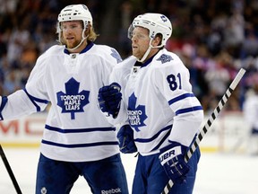 Toronto's Phil Kessel, right, celebrates with Michael Kostka against the Tampa Bay Lightning Wednesday. (AP Photo/Chris O'Meara)