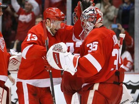 Detroit's Pavel Datsyuk, left, celebrates with Jimmy Howard after a 5-2 win over the Nashville Predators at Joe Louis Arena. (Photo by Tom Szczerbowski/Getty Images)