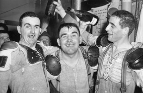 Jack Costello, from left, Real Chevrefils and Tom Micallef celebrate after the Windsor Bulldogs won the Allan Cup against the Winnipeg Maroons. (Star file photo)