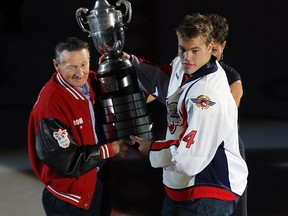 Walter Gretzky, left, presents Windsor's Taylor Hall with the Wayne Gretzky trophy at the WFCU Centre in Windsor. (TYLER BROWNBRIDGE/The Windsor Star)