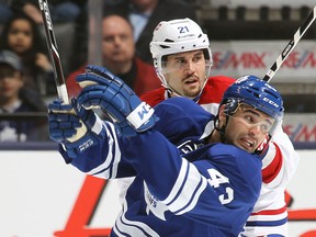 Montreal's Tomas Pleckanec, right, checks Toronto's Nazem Kadri at the Air Canada Centre. (Photo by Claus Andersen/Getty Images)