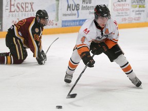 Essex captain Kevin Boggs, right, makes a move on Grimsby's Cooper Naugoris during Game 4 of the Schmalz Cup semifinal series in Essex last year. (DAX MELMER/The Windsor Star)