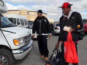 Windsor Express players Eric Parker, left, and Daniel Rose board an airport shuttle on their way to Game 5 of their playoff series against the  Summerside Storm Monday. (NICK BRANCACCIO/The Windsor Star)