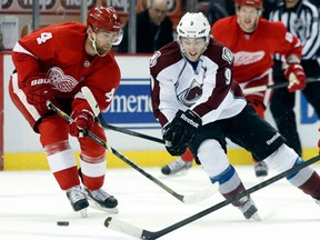 Detroit ddefenceman Jakub Kindl, left, checks Colorado's Matt Duchene Monday in Detroit. (AP Photo/Duane Burleson)