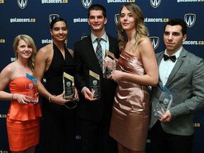 Award winners Meaghan Pototschnik, from left, Miah-Marie Langlois, Jordan Brescacin, Jessica Clemencon and Massimo Megna pose for a photo during the University of Windsor student athlete awards banquet at the St. Clair Centre of the Arts in Windsor Wednesday.      (TYLER BROWNBRIDGE/The Windsor Star)