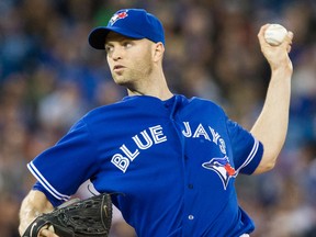 Blue Jays starting pitcher J.A. Happ throws a pitch against the Boston Red Sox in the first inning Saturday. (THE CANADIAN PRESS/Chris Young)