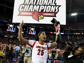 Louisville's Zach Price celebrates after a 82-76 win against the Michigan Wolverines during the NCAA Men's Final Four Championship at the Georgia Dome in Atlanta. (Photo by Andy Lyons/Getty Images)