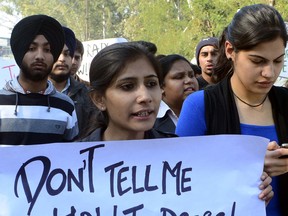 Indian students hold placards during a protest in Amritsar on Thursday. A Dec. 16 sex assault on a bus in New Delhi, which left a 23-year-old victim fighting for her life, has triggered nationwide protests in India. AFP PHOTO/ NARINDER NANU/ Getty Images)