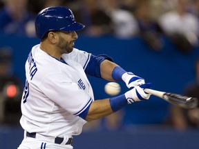 Toronto Blue Jays Jose Bautista strikes out during 8th inning AL opening day baseball action against the Cleveland Indians in Toronto on Tuesday, April 2, 2013. THE CANADIAN PRESS/Frank Gunn