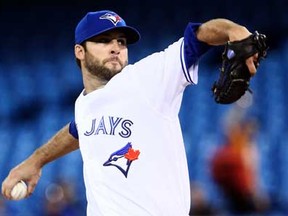 Toronto's Brandon Morrow throws a pitch in the first inning against the Cleveland Indians at the Rogers Centre April 3, 2013 in Toronto. (Abelimages/Getty Images)