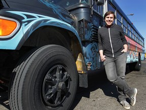 The Detroit Bus Company's founder Andy Didorosi poses next to one of his buses in Detroit, MI, Saturday, March 30, 2013. (DAN JANISSE/The Windsor Star)