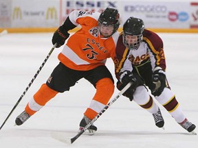 Essex's Daniel McIntyre, left, cuts around the Grimsby's Dalton Procyshn during Game 1 of the Schmalz Cup semifinal at Essex Arena in Essex Tuesday, April 2, 2013.                        (TYLER BROWNBRIDGE/The Windsor Star)