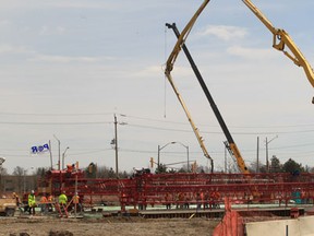 A large scale concrete pour takes place on Monday during construction of the Herb Gray Parkway in Windsor, Ontario on April 15, 2013 in Windsor, Ontario. The Parkway is the access road portion of a new proposed end-to-end border transportation system at Canada's busiest land border crossing and premier trade corridor.  (JASON KRYK/The Windsor Star)