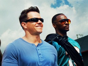 This undated publicity photo released by courtesy of Paramount Pictures shows, from left, Dwayne Johnson as Paul Doyle, Mark Wahlberg as Daniel Lugo and Anthony Mackie as Adrian Doorbal in the film, "Pain and Gain," directed by Michael Bay from Paramount Pictures. The film releases in theaters April 26, 2013. (AP Photo/Paramount Pictures)