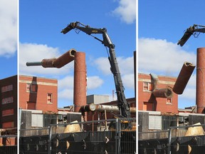 The smokestack at the Grace Hospital site topples to the ground during demolition on April 1, 2013 in Windsor, Ontario. (JASON KRYK/ THE WINDSOR STAR)